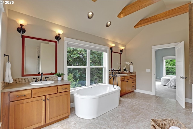 10455 NW Laidlaw Rd, Portland, OR 97229 - full bath featuring two vanities, a soaking tub, beamed ceiling, healthy amount of natural light, and recessed lighting
