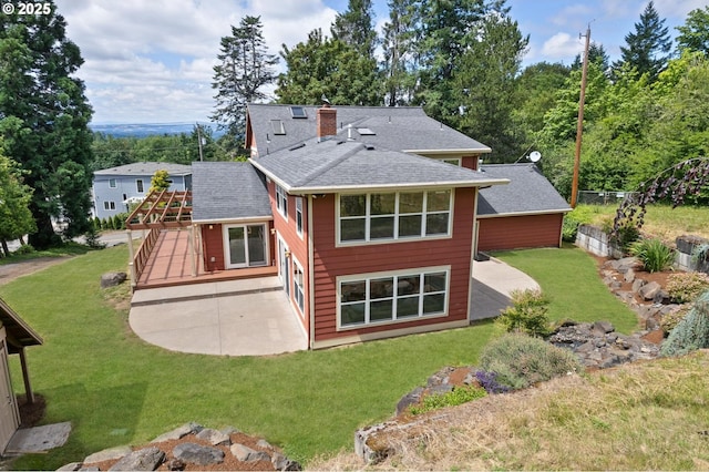 10455 NW Laidlaw Rd, Portland, OR 97229 - rear view of property with a patio area, a shingled roof, a chimney, a lawn, and a deck