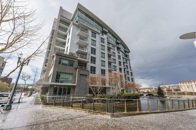view of building exterior with a water view