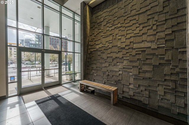 1260 NW Naito Pkwy Unit 200B, Portland, OR 97209 - building lobby with a high ceiling and floor to ceiling windows
