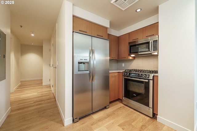 1260 NW Naito Pkwy Unit 200B, Portland, OR 97209 - hall with light wood-type flooring and baseboards