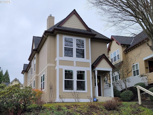 view of front of home featuring a chimney