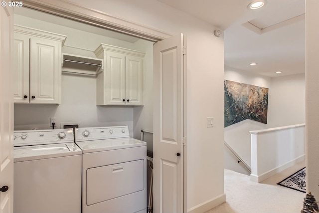 laundry area with cabinets and independent washer and dryer