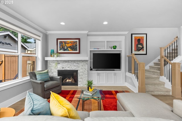 2516 N Watts St, Portland, OR 97217 - living area with a stone fireplace, stairway, wood finished floors, built in features, and recessed lighting