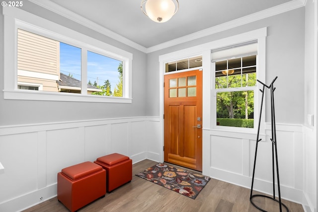 2516 N Watts St, Portland, OR 97217 - foyer featuring a decorative wall, plenty of natural light, crown molding, a wainscoted wall, and wood finished floors