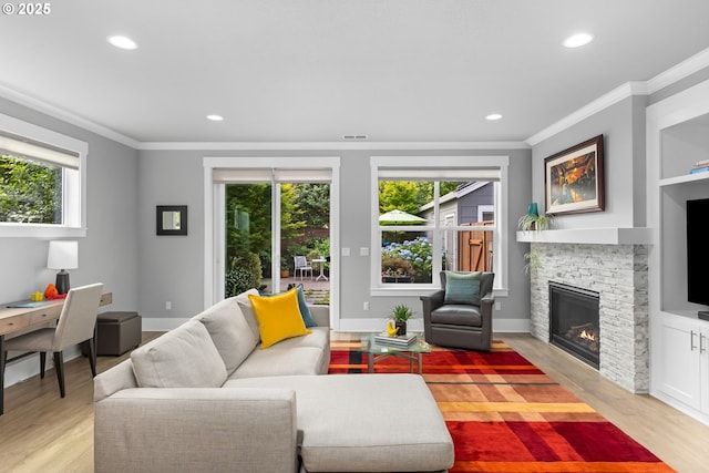 2516 N Watts St, Portland, OR 97217 - living room featuring ornamental molding, plenty of natural light, light wood finished floors, a fireplace, and recessed lighting