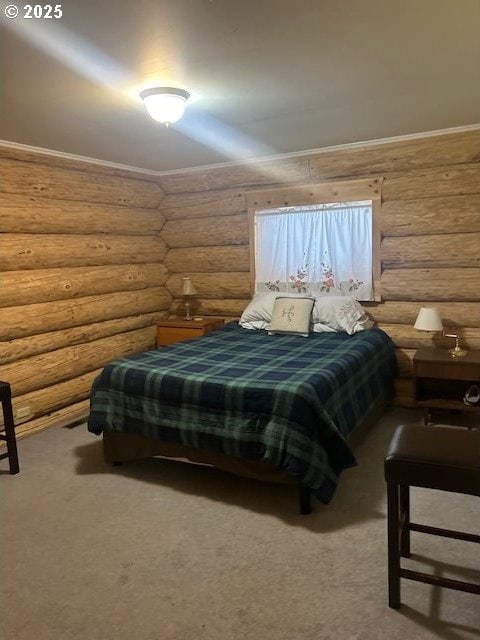 bedroom with log walls, ornamental molding, and carpet flooring