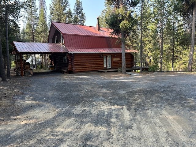 view of front of home with a carport