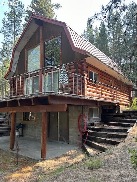 rear view of property featuring a patio