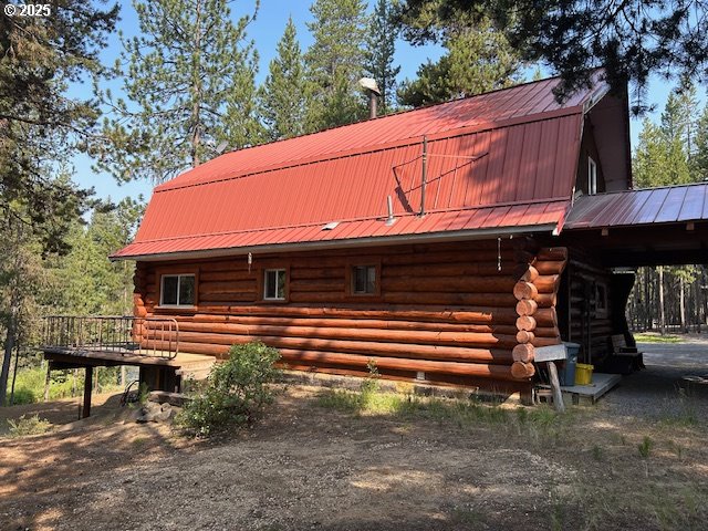 view of home's exterior featuring an outdoor structure