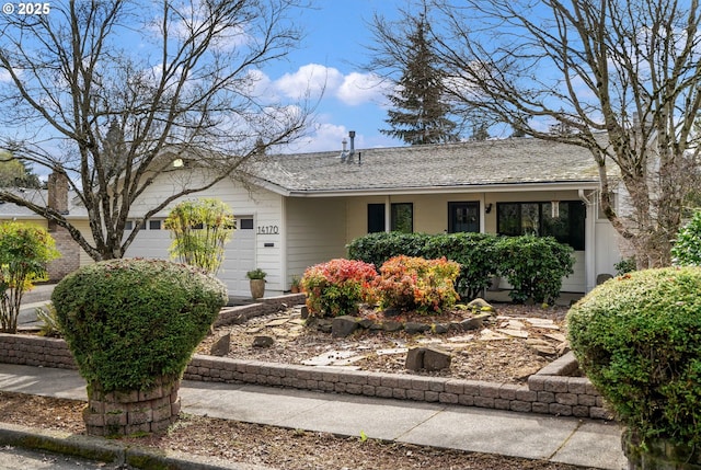 single story home with roof with shingles and an attached garage