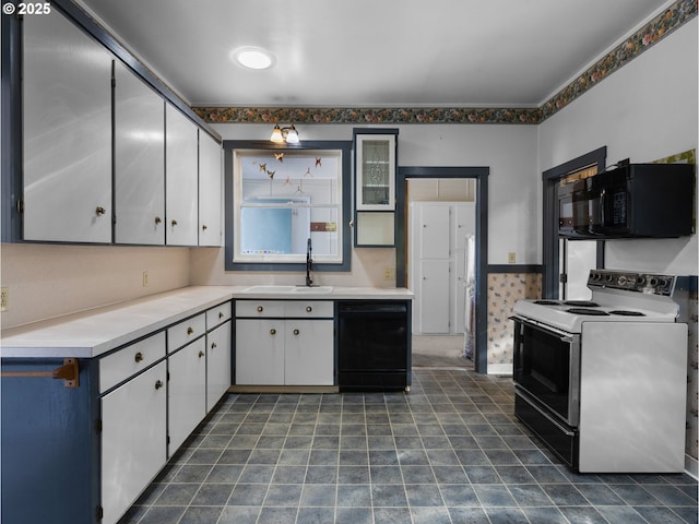 682 S Settlemier Ave, Woodburn, OR 97071 - kitchen featuring black appliances, a sink, light countertops, and white cabinets