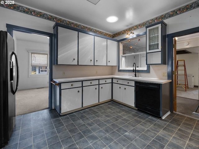 682 S Settlemier Ave, Woodburn, OR 97071 - kitchen with black appliances, a sink, light countertops, white cabinetry, and dark colored carpet