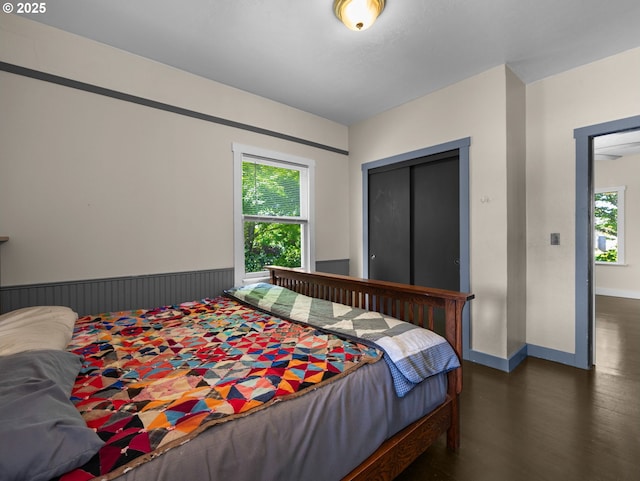 682 S Settlemier Ave, Woodburn, OR 97071 - bedroom with dark wood-type flooring and baseboards