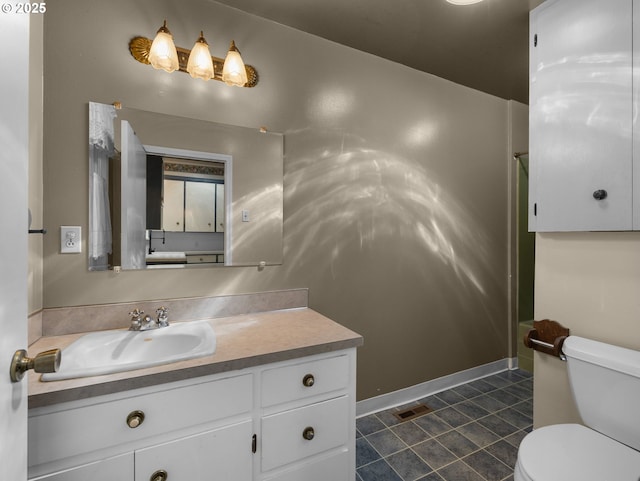 682 S Settlemier Ave, Woodburn, OR 97071 - bathroom featuring vanity, toilet, and tile patterned flooring