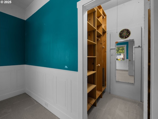 682 S Settlemier Ave, Woodburn, OR 97071 - corridor featuring carpet floors and a wainscoted wall