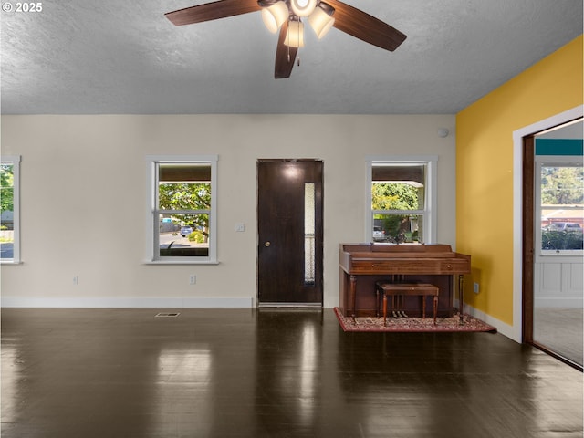682 S Settlemier Ave, Woodburn, OR 97071 - entrance foyer featuring a textured ceiling, plenty of natural light, and wood finished floors