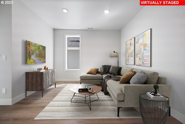 living room with light hardwood / wood-style floors