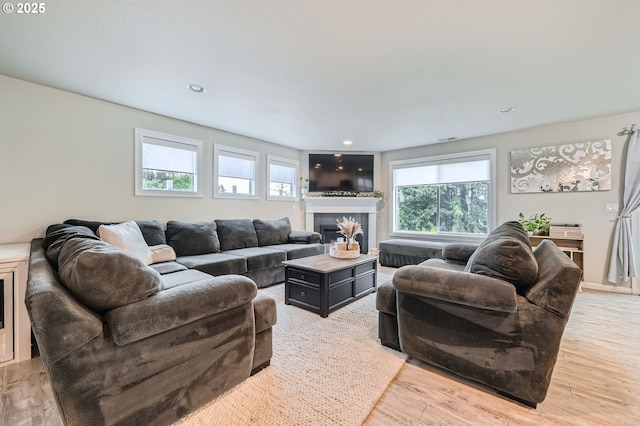 1225 NE Rockwell Dr, Estacada, OR 97023 - living room with light wood-style floors, a tiled fireplace, and recessed lighting