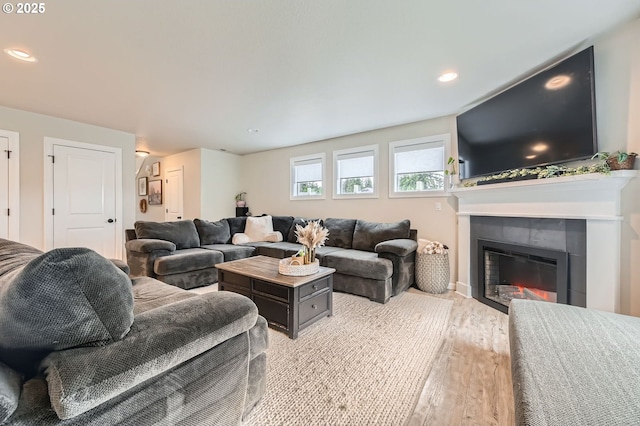 1225 NE Rockwell Dr, Estacada, OR 97023 - living room featuring wood finished floors, a glass covered fireplace, recessed lighting, and baseboards