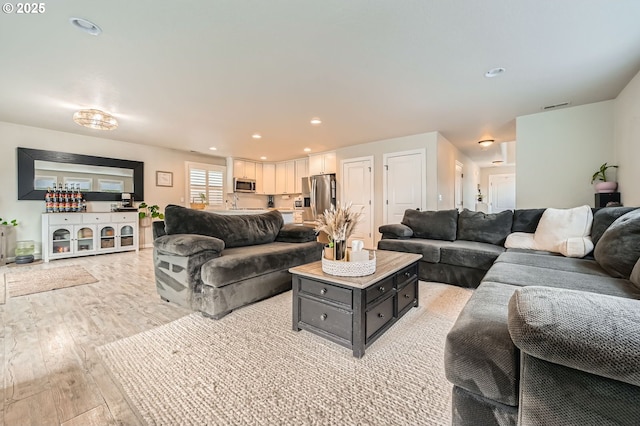 1225 NE Rockwell Dr, Estacada, OR 97023 - living area featuring light wood-style flooring and recessed lighting