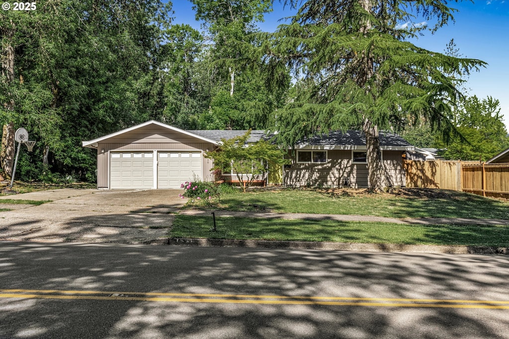 4880 Donald St, Eugene, OR 97405 - view of front of house with asphalt driveway and an attached garage