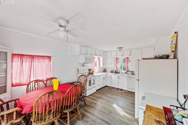 2745 34th St, Coos Bay, OR 97420 - kitchen with white appliances, a sink, light countertops, and white cabinetry