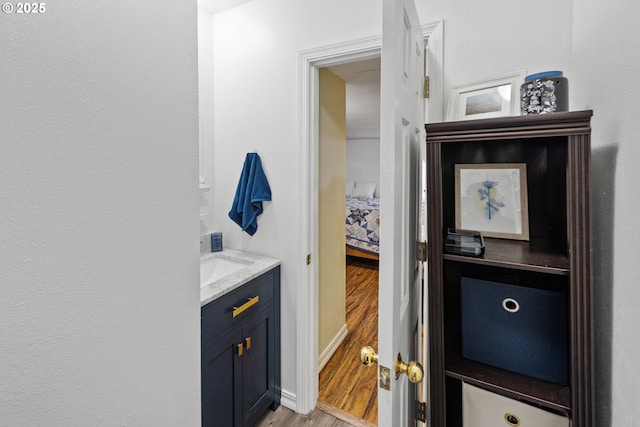 2745 34th St, Coos Bay, OR 97420 - bathroom with vanity, wood finished floors, and connected bathroom