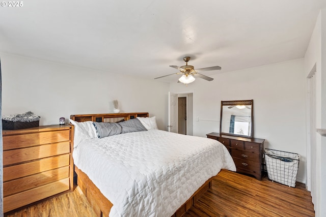 2745 34th St, Coos Bay, OR 97420 - bedroom with a baseboard radiator, wood finished floors, crown molding, baseboards, and ceiling fan