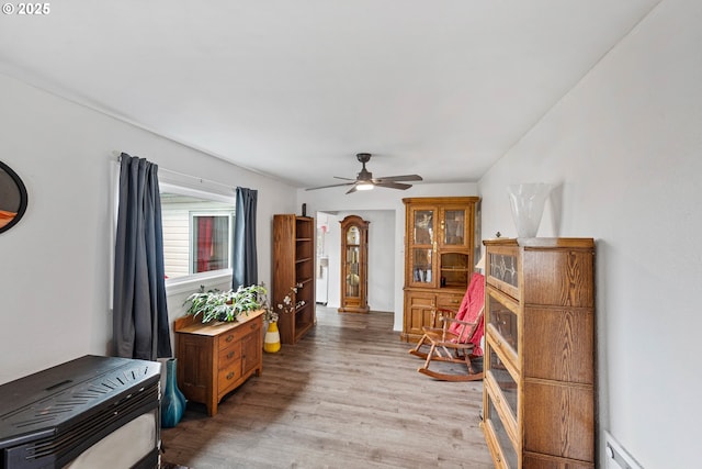 2745 34th St, Coos Bay, OR 97420 - sitting room featuring light wood-style flooring, ceiling fan, and heating unit