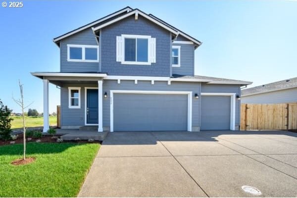1586 N Millican Creek St, Lafayette, OR 97127 - traditional-style home with driveway, an attached garage, and a porch