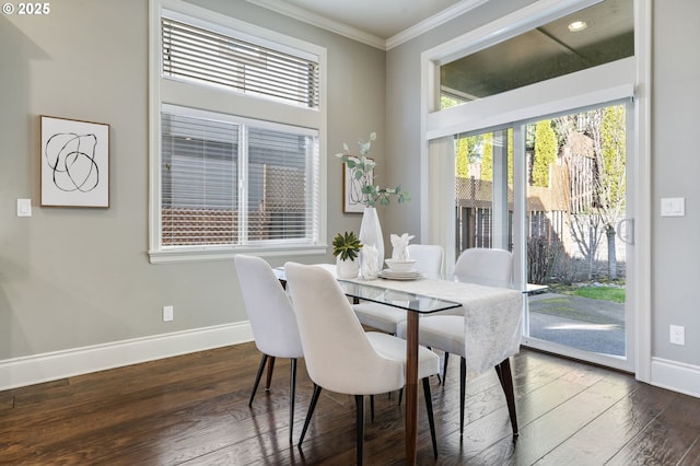 dining area with baseboards, dark wood-style flooring, and crown molding