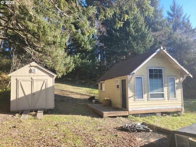 view of property exterior featuring a shed