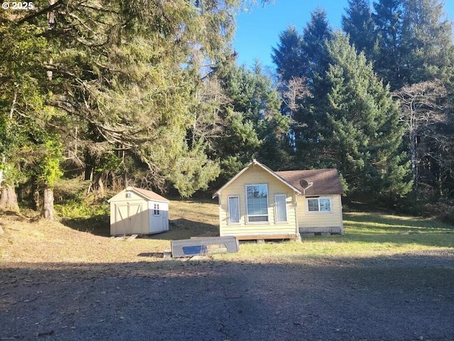 view of front of house with a shed