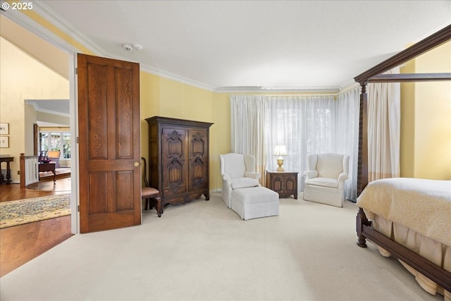 carpeted bedroom with ornamental molding