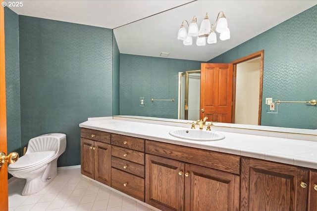 bathroom featuring an enclosed shower, vanity, toilet, and tile patterned flooring