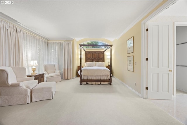 bedroom with light colored carpet and ornamental molding