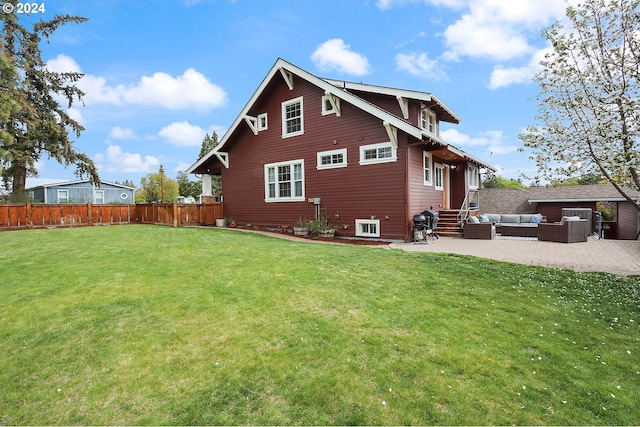 rear view of property featuring an outdoor living space, a lawn, and a patio