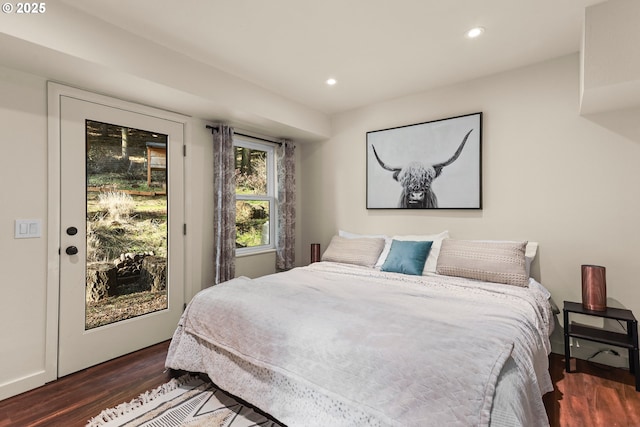 bedroom featuring recessed lighting, dark wood finished floors, and access to exterior