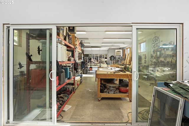 interior space featuring a workshop area and concrete floors