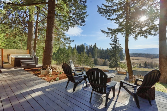 wooden deck with a hot tub