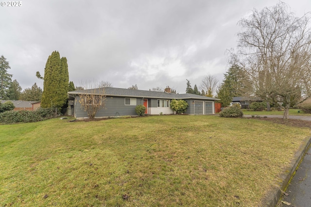 single story home featuring a garage and a front yard