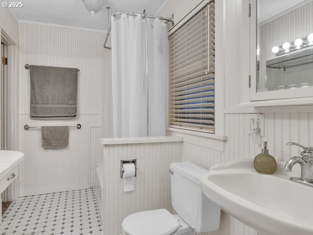 bathroom with toilet and a sink