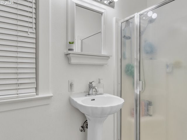 bathroom with a shower stall