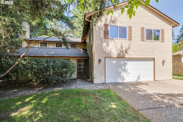 view of front of home with a garage, concrete driveway, and roof with shingles