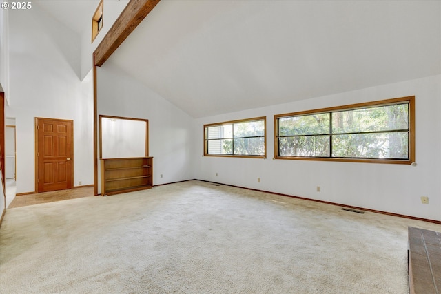 unfurnished room featuring high vaulted ceiling, beam ceiling, carpet, and baseboards