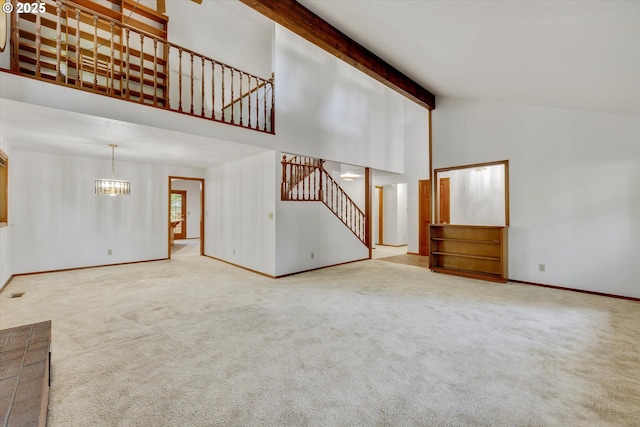 unfurnished living room featuring stairs, a chandelier, baseboards, carpet flooring, and high vaulted ceiling