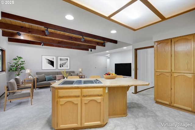kitchen featuring open floor plan, light carpet, light brown cabinetry, a center island, and wood ceiling