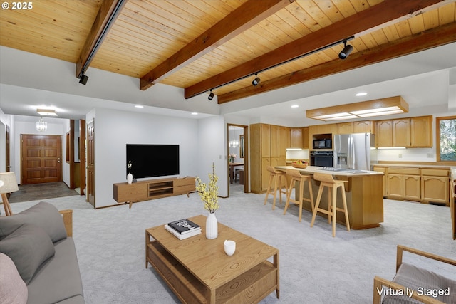 living area with wood ceiling, track lighting, light colored carpet, beam ceiling, and recessed lighting