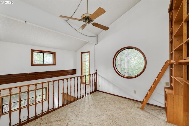 hall featuring carpet floors and baseboards
